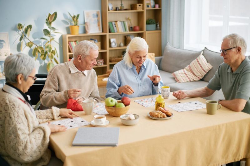 Seniors gathered around table